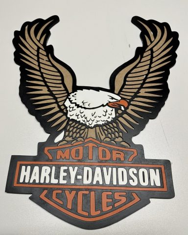 Logo von Harley-Davidson mit einem Adler und dem Schriftzug "Motor Cycles".
